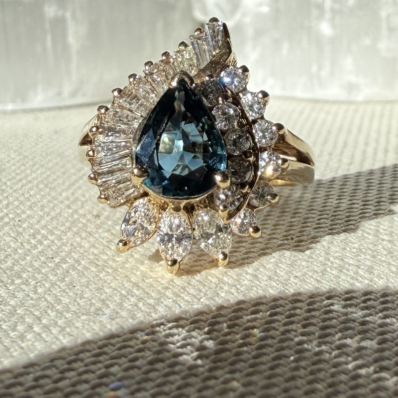 Pear Shaped Teal Sapphire and Diamond Spiral Halo Ring
