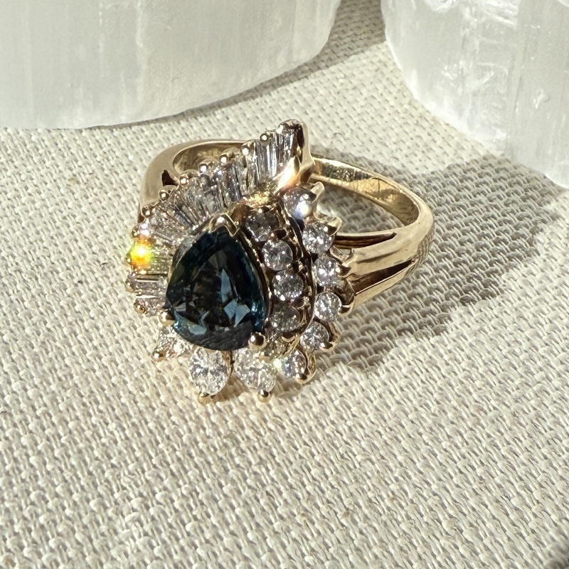 Pear Shaped Teal Sapphire and Diamond Spiral Halo Ring