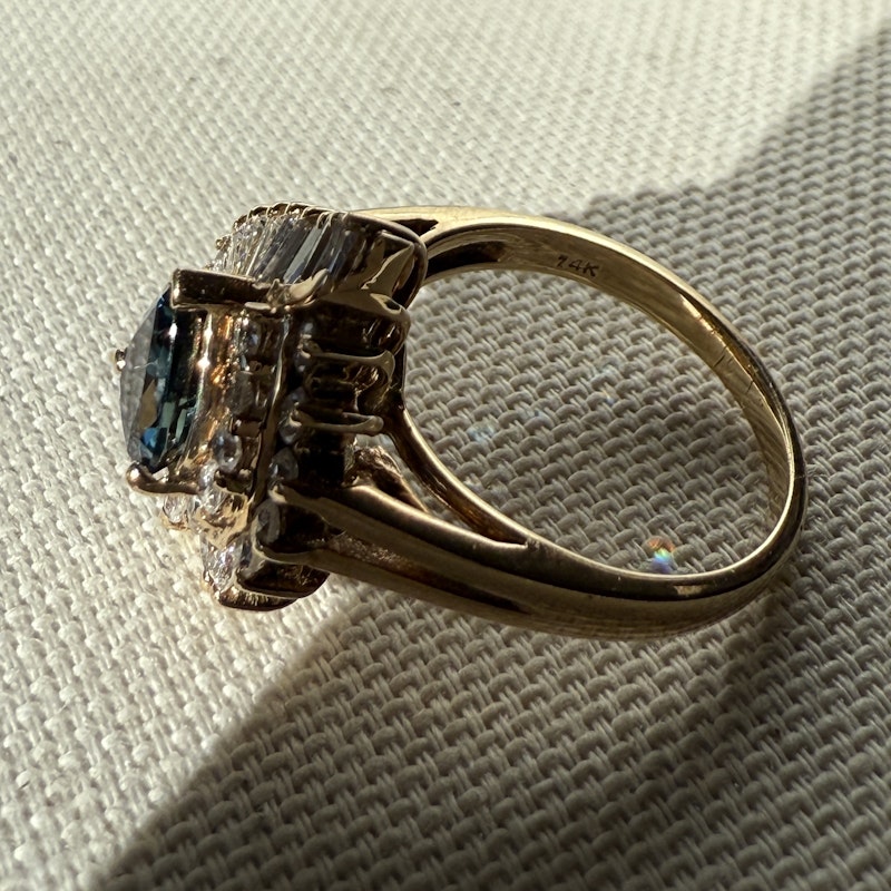 Pear Shaped Teal Sapphire and Diamond Spiral Halo Ring