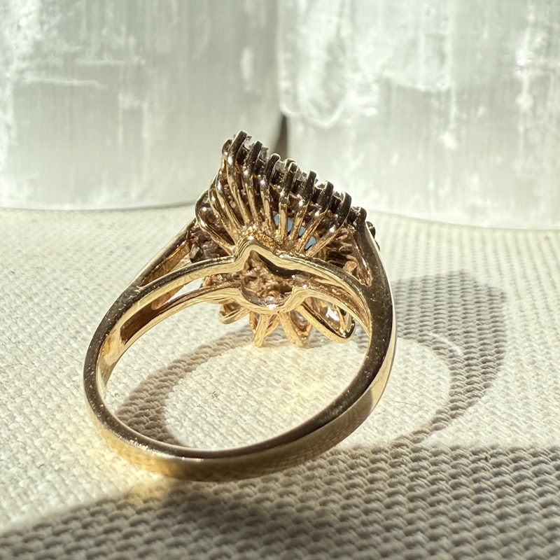 Pear Shaped Teal Sapphire and Diamond Spiral Halo Ring